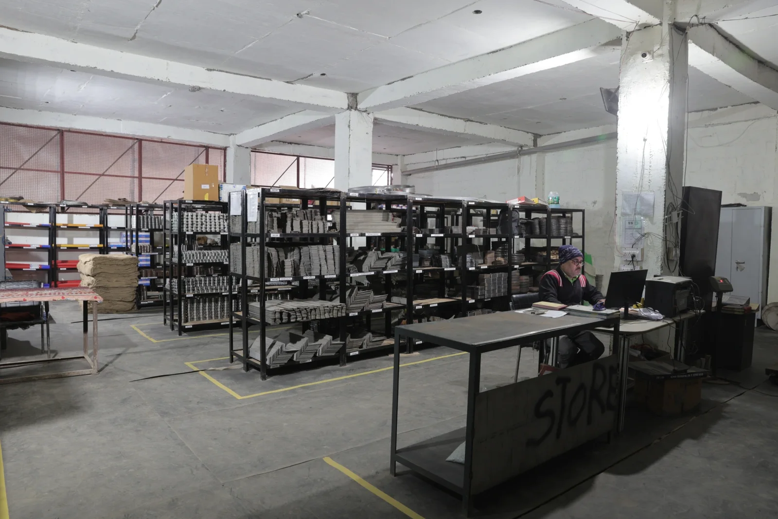 Organised component stores with labelled racking and floor marking
